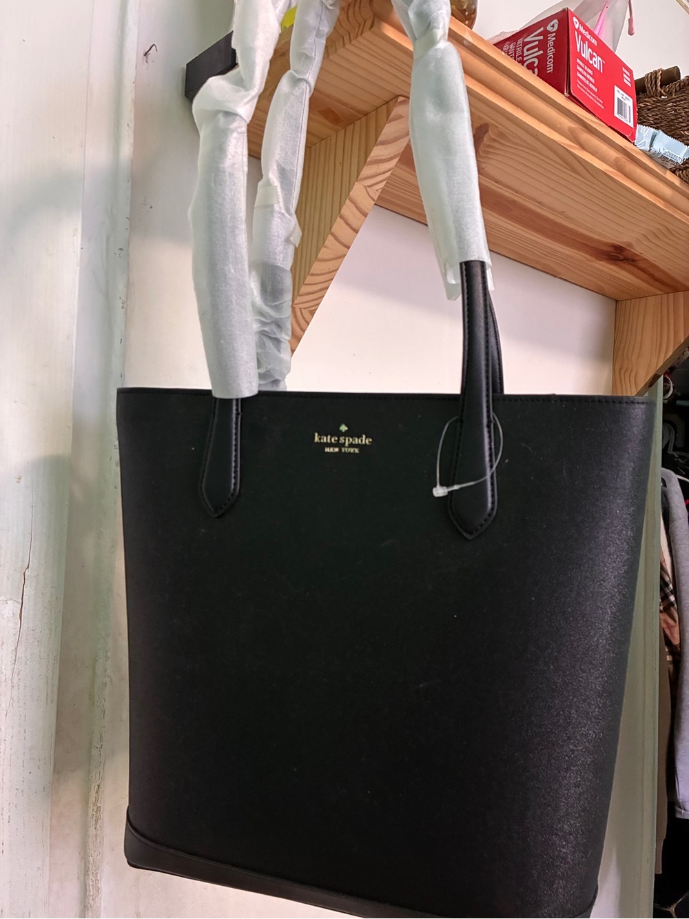 kate spade sparkly black leather tote with gold logo